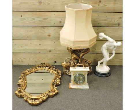 A gilt framed wall mirror, together with a marble mantle clock and an ornate table lamp and shade and a classical figure, 46c