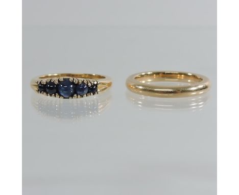 An 18 carat gold wedding band, together with a gold and sapphire ladies ring 