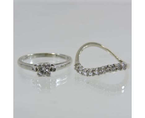 A platinum single stone diamond ring, together with a diamond half hoop eternity ring