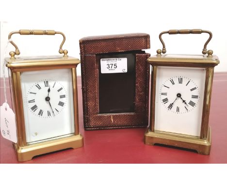 A 19th century French brass carriage clock complete with red leather travel case together with another carriage clock (a.f).