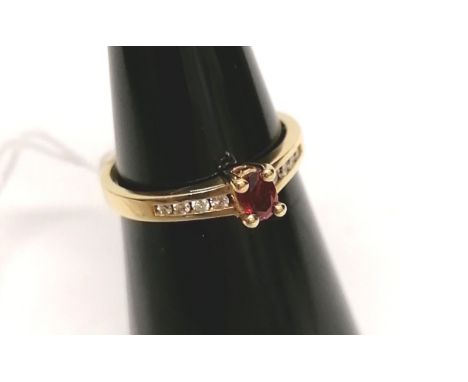 A 14 ct gold, ruby and diamond dress ring.