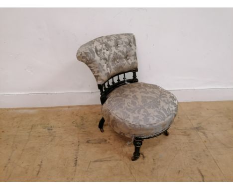 A late Victorian ebonised button nursing chair. 
