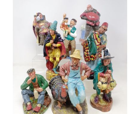 A Royal Doulton figure, The Foaming Quart HN2162, Carpet Seller HN1464, Falstaff HN2054, The Mask Seller HN2103, The Wayfarer