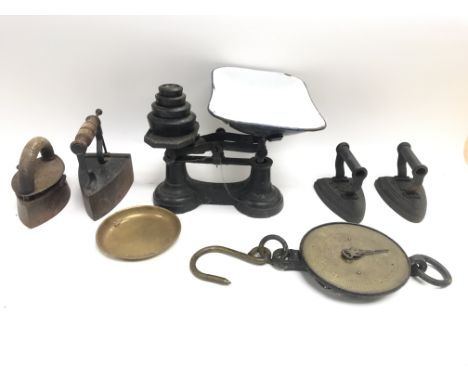 Collection of vintage irons and scales.