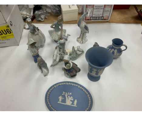 A collection of Wedgwood lladro and nao.