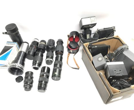 A collection of camera lenses and other related camera items.