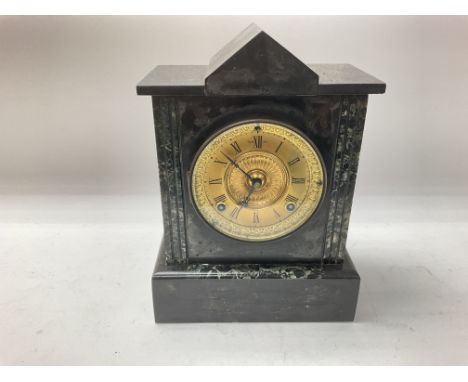 A slate mantle clock 30cm by 22cm approximately