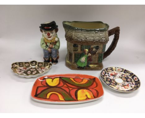 A Poole dish, two small Crown Derby dishes, Doulton jug and 'The Clown' Toby jug (5). NO RESERVE