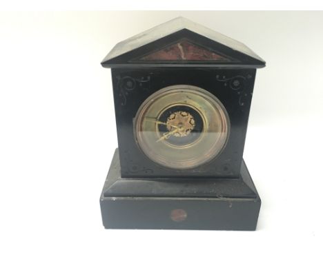 A Victorian slate mantle clock.