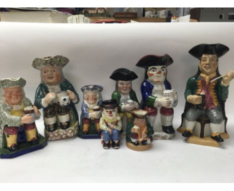 A good collection of Tobys jugs including Doulton and spode