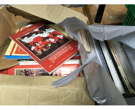 A collection of vintage Arsenal Football programmes and assorted books