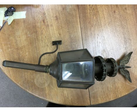 A brass coaching lamp