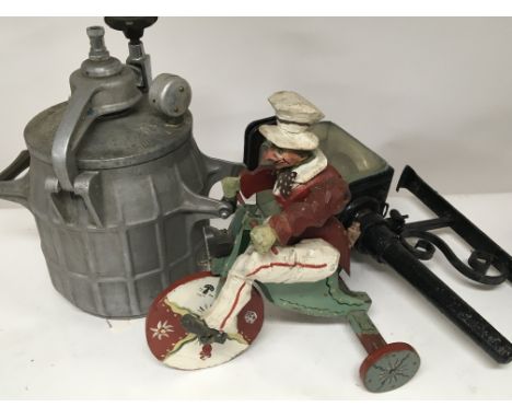 A Vintage painted wooden figure on a tricycle an old metal lamp and a vintage pressure cooker.(3) postage category C. NO RESE