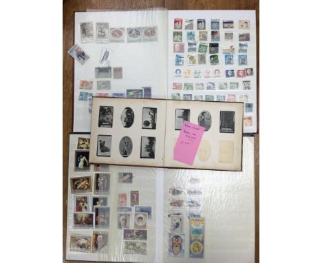 Stamp collection and photo album contain vintage Ogden's cigarette cards