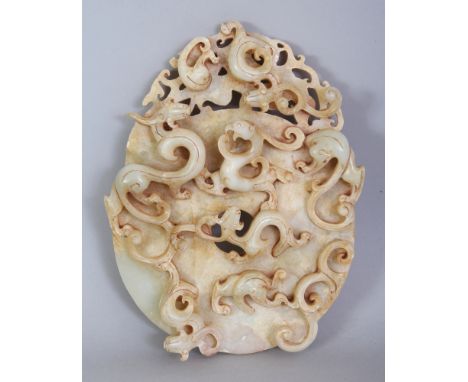 A CHINESE JADE-STYLE BI DISC, modelled in high archaic relief with a group of sinuous chilong, 6.7in high & 5.1in wide.