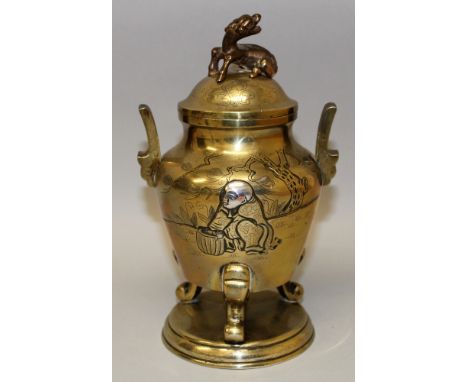 A GOOD QUALITY JAPANESE MEIJI PERIOD MIXED METAL TRIPOD KORO & COVER, decorated to one side with a kneeling figure and a bask