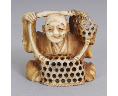 A SIGNED JAPANESE MEIJI PERIOD IVORY NETSUKE OF A SEATED BASKET SELLER, the base with an engraved signature, 1.5in wide at wi