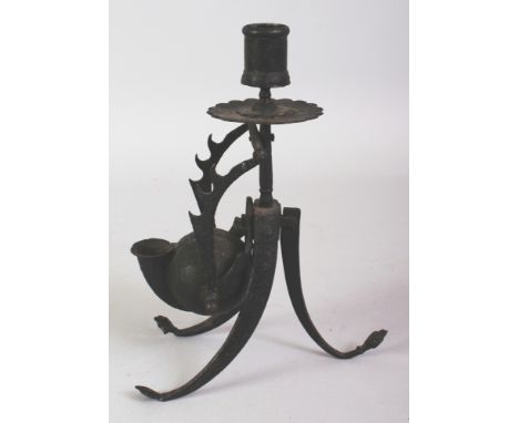 A PERSIAN IRON TRAVELLING SCRIBES IMPLEMENT, 19th century or earlier, with rotating ink holder beneath a pen rack and a candl