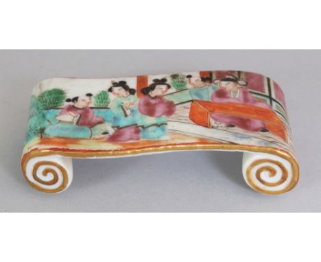 A 19TH CENTURY CHINESE CANTON PORCELAIN WRIST REST, with scroll ends, its top surface painted with a figural terrace scene, 3