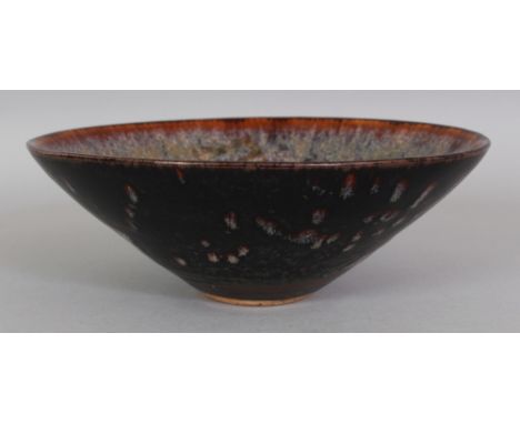 A CHINESE SONG STYLE JIZHOU PAPERCUT CERAMIC BOWL, the interior decorated with three mythical animals, 6.3in diameter & 2.25i