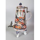 A SAMSON EARLY IMARI STYLE PORCELAIN CISTERN & COVER, supported on three scroll feet, fitted to