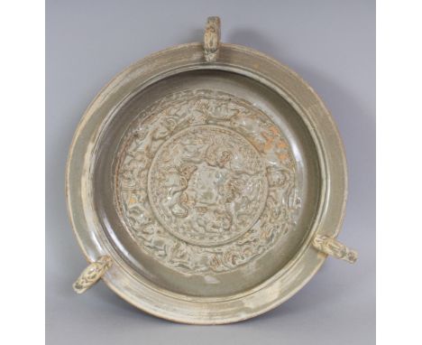 A CHINESE SONG/YUAN STYLE CELADON TRIPOD CENSER, with three dragon handles, the interior moulded with circular bands of mythi