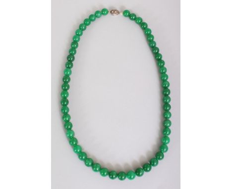 A CHINESE DARK APPLE-GREEN JADE NECKLACE, composed of spherical beads, approx. 25.25in long.
