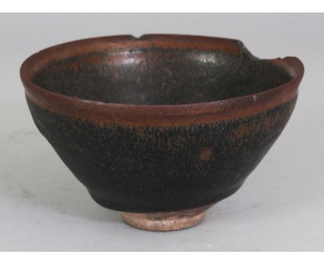 A CHINESE SONG DYNASTY JIAN WARE HARE'S FUR GLAZED CERAMIC BOWL, the sides with a black streaked glaze falling short of the f