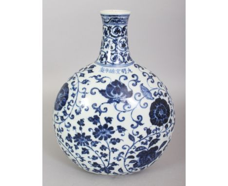 A CHINESE MING STYLE BLUE & WHITE PORCELAIN MOON FLASK, the sides decorated with scrolling flowerheads, the shoulders with an