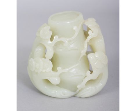 A CHINESE CELADON JADE-LIKE MODEL OF BAMBOO & PLUM BLOSSOM, 2.75in wide & 2.8in high.