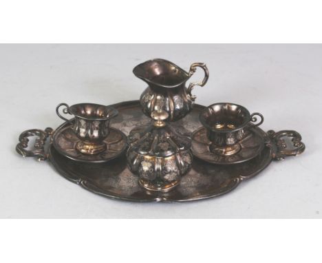 A GROUP OF ORIENTAL MINIATURE SILVER-METAL TEA WARES, comprising a tray, a milk jug, a sugar basin and cover, and two cups an