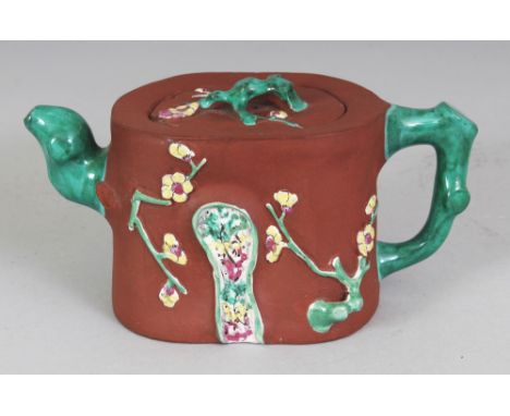 A 19TH CENTURY CHINESE ENAMELLED YIXING POTTERY TEAPOT & COVER, the sides moulded and enamelled in relief with sprigs of blos