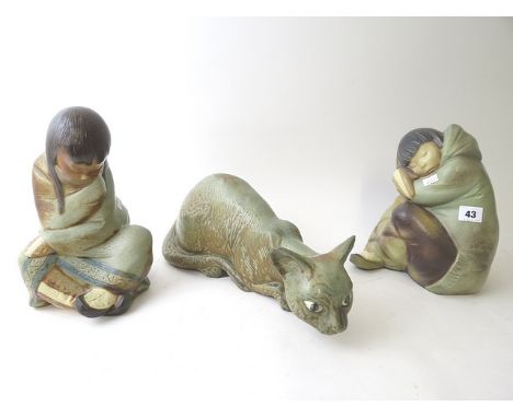 Two Lladro Gres figurines of Eskimos, Slumber, model number 2540 and Nap, model number 2541, along with an unmarked Lladro Gr