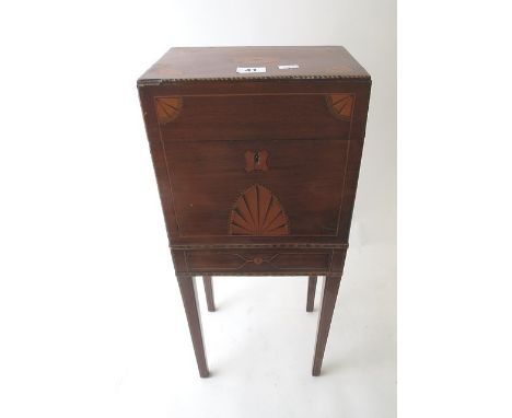 An Edwardian inlaid mahogany decanter box on square tapering legs and brass carrying handles, 21 1/2 x 9 2/8 x 6 2/8