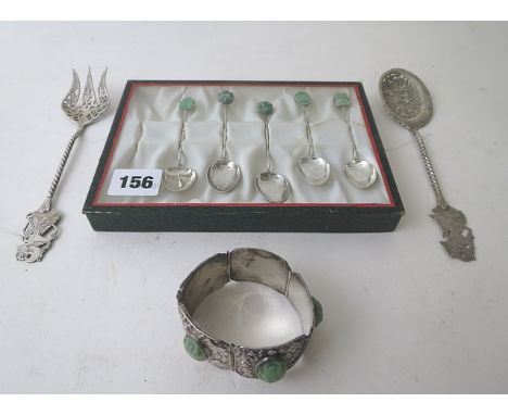 A Chinese 800 silver spoon and fork with pierced decoration and figural finials, a boxed set of five Chinese silver spoons wi