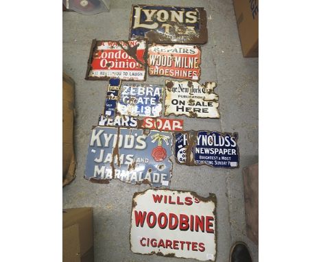 A selection of enamel advertising signs to include a Lyons finger door plate, The New York Times Sign, London Opinion and oth