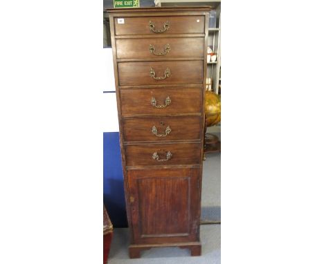 A George III mahogany secretaire, four graduated drawers above a fitted secretaire drawer with pigeonholes and drawers, above