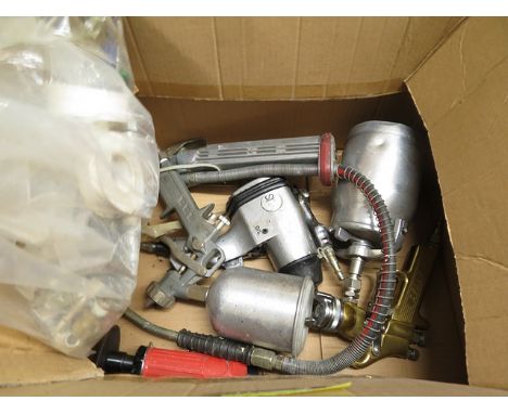 An air gun, two spray guns and hand tools