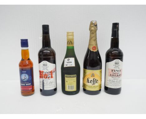 A collection of alcohol - including two bottles of Sherry, a bottle of Leffe bier, Caribbean dark rum, and Napoleon brandy