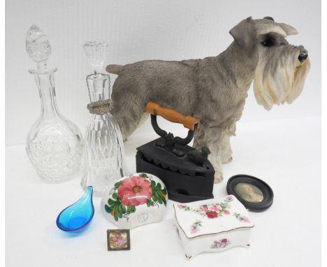 A Schnauzer dog figure , two crytal decanters, cast iron iron, trinket box with lid, small wall planter, a framed picture of 