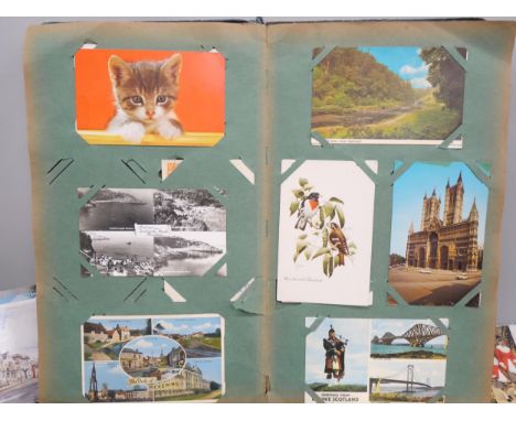 A large collection of loose postcards and a vintage postcard album 
