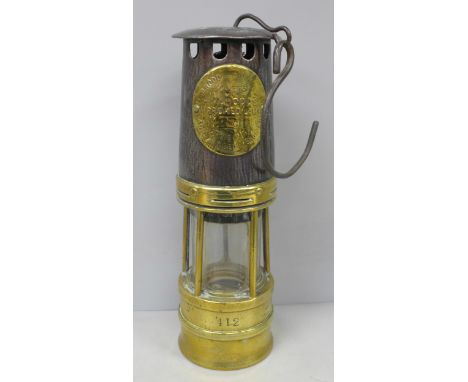 A brass miner's lamp, Hailwood &amp; Ackroyd