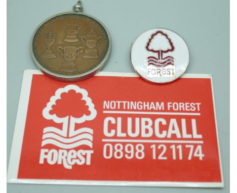 A Nottingham Forest medallion, badge and clubcall card