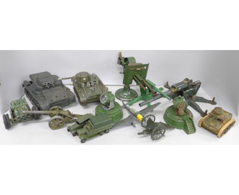 A collection of military models, a Dinky Toys aircraft, guns including Astra, a tin-plate Gama Tank, a clockwork tank, a smal