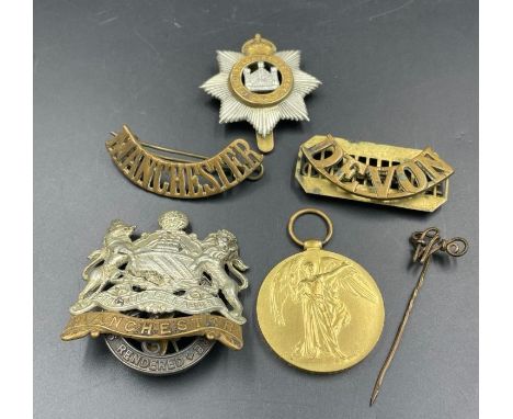 A small selection of Military insignia and a WWI Ware Medal for 54147 PTE W C WEEKS MANCH R