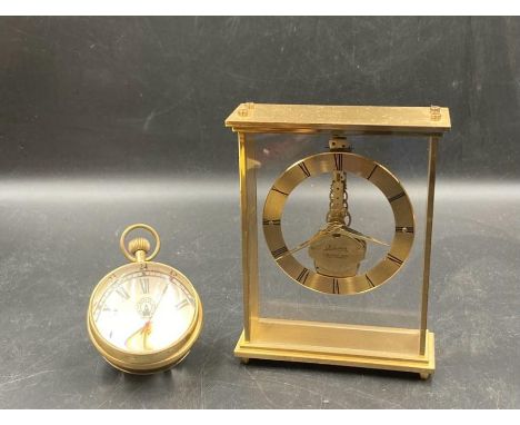 Two clocks, A Roskoff and Co glass spherical desk clock and a carriage clock by Kaiser 