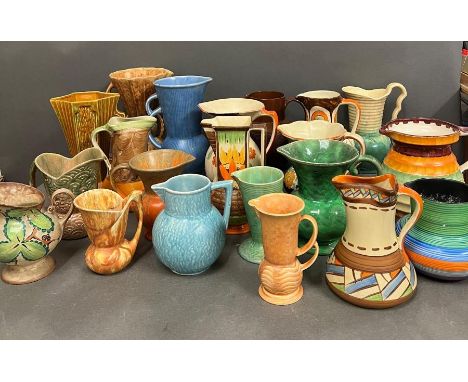 A large selection of pottery jugs various makers to include Kensington Ware, Myott etc.