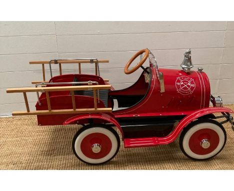 An F.A.O Schwartz or New York child's pedal fire engine 