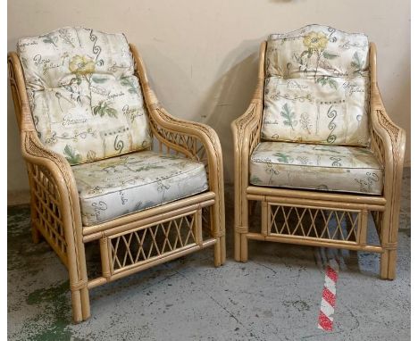 A bamboo three piece conservatory suite consisting of a two seater sofa and two arm chairs 