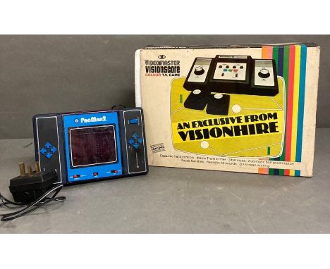 A Video master Vision score console and a Pacman two, two player video game 